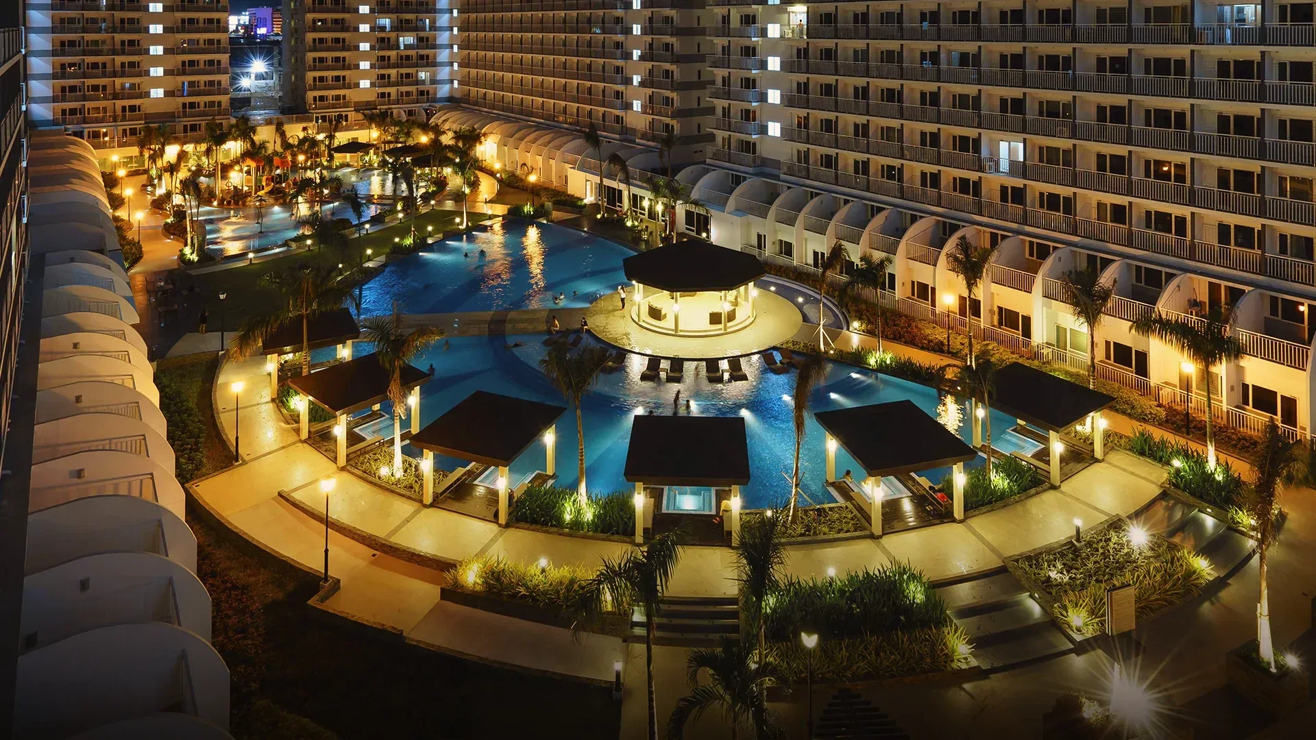 A swimming pool at Shell Residences at night.